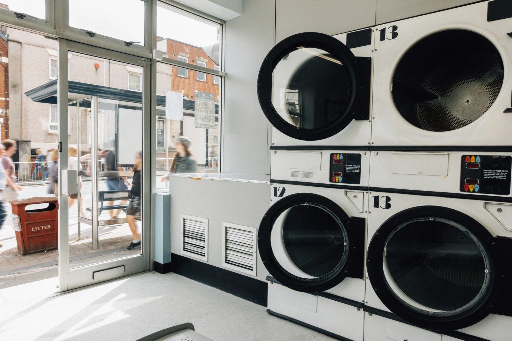 Stacked commercial dryers in a self-service laundromat
